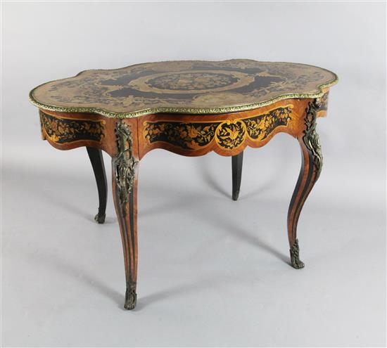 A 19th century Louis XV style marquetry, ebony and kingwood centre table, W.4ft 4in. D.2ft 9in. H.2ft 7in.